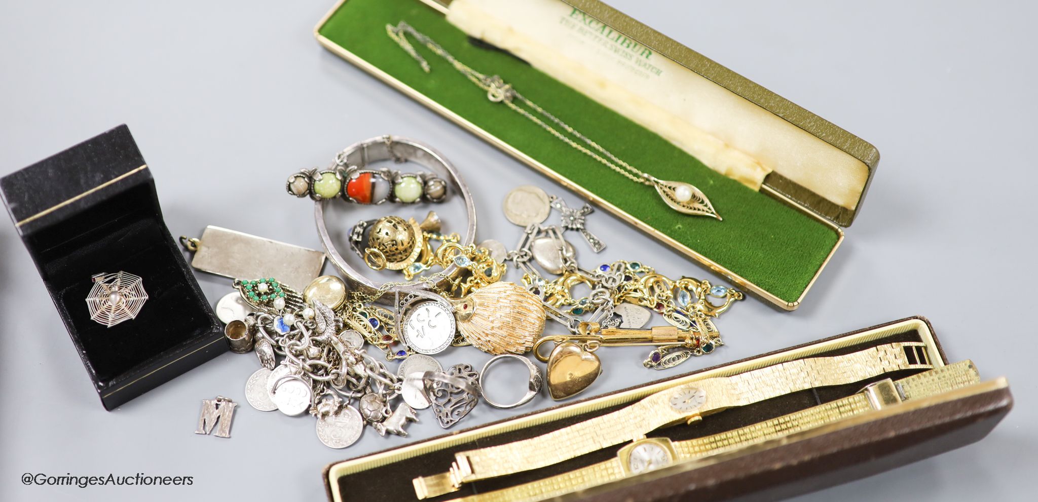 A small quantity of jewellery and watches including silver pendant, silver bracelet, two gold plated watches, costume jewellery etc.